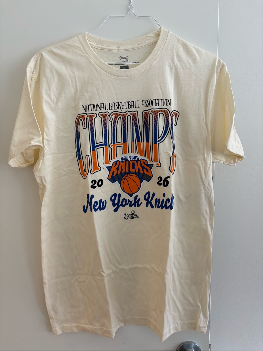 NBA Cream Tee with Blue and Orange Knicks CHAMPS Graphic